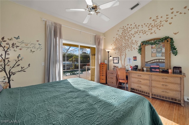 bedroom featuring ceiling fan, wood-type flooring, access to outside, and vaulted ceiling