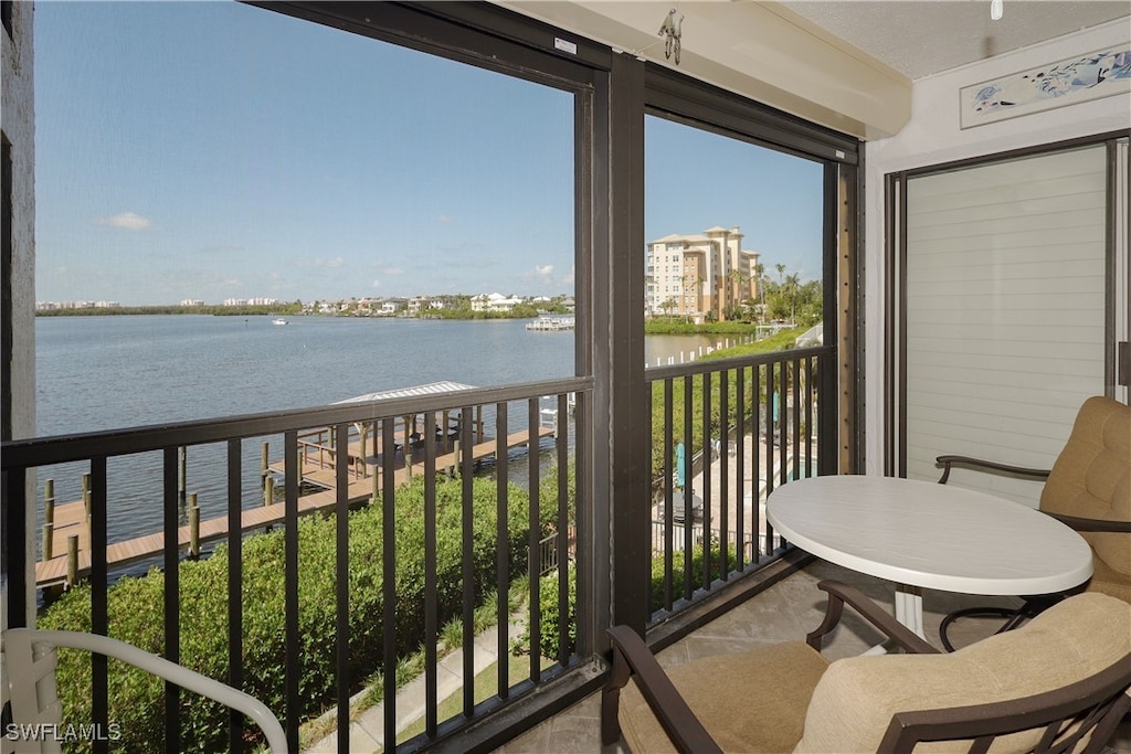 balcony featuring a water view