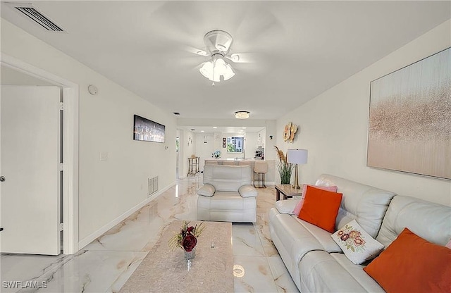 living room featuring ceiling fan