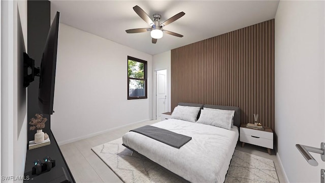 bedroom featuring ceiling fan and light hardwood / wood-style flooring