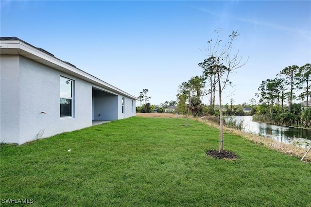 view of yard with a water view