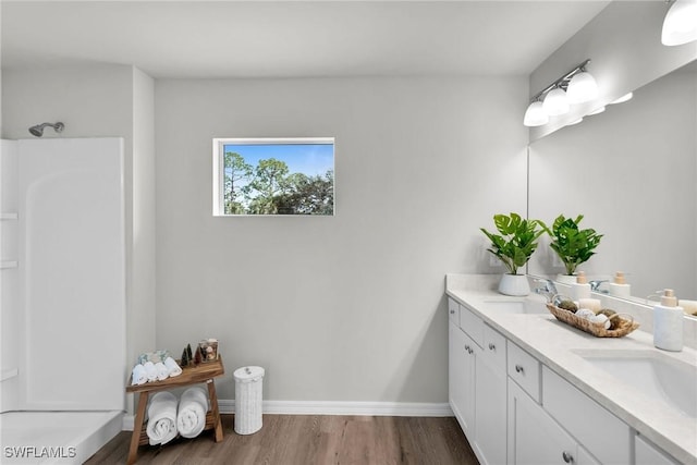 bathroom with hardwood / wood-style floors and vanity