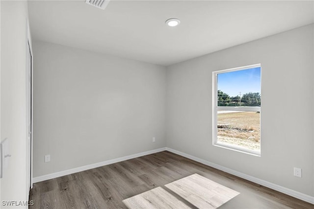 spare room featuring light wood-type flooring