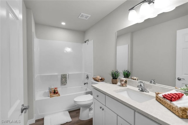 full bathroom featuring toilet, shower / washtub combination, vanity, and hardwood / wood-style flooring