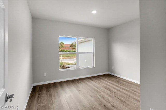 unfurnished room featuring light hardwood / wood-style flooring