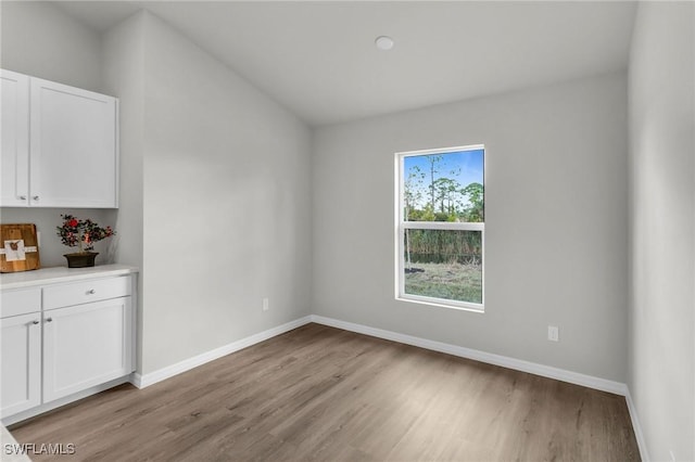 unfurnished dining area with light wood-type flooring