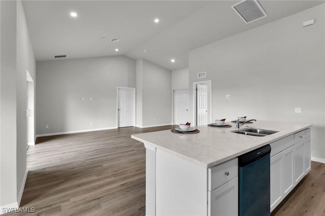 kitchen featuring sink, a center island with sink, black dishwasher, light hardwood / wood-style floors, and white cabinetry