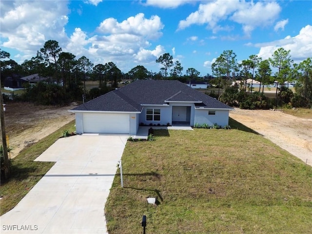 ranch-style home with a front yard and a garage