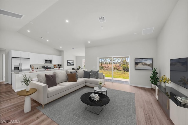 living area with high vaulted ceiling, recessed lighting, visible vents, baseboards, and light wood finished floors