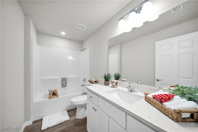 full bathroom featuring visible vents, vanity, toilet, and wood finished floors