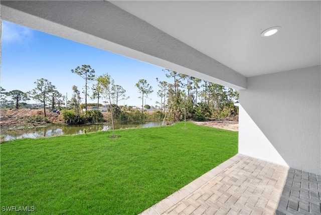 view of yard with a water view