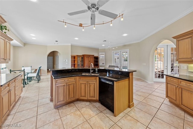 kitchen featuring french doors, sink, light tile patterned floors, black dishwasher, and an island with sink