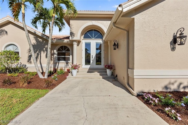 property entrance featuring french doors