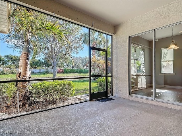 unfurnished sunroom with a healthy amount of sunlight