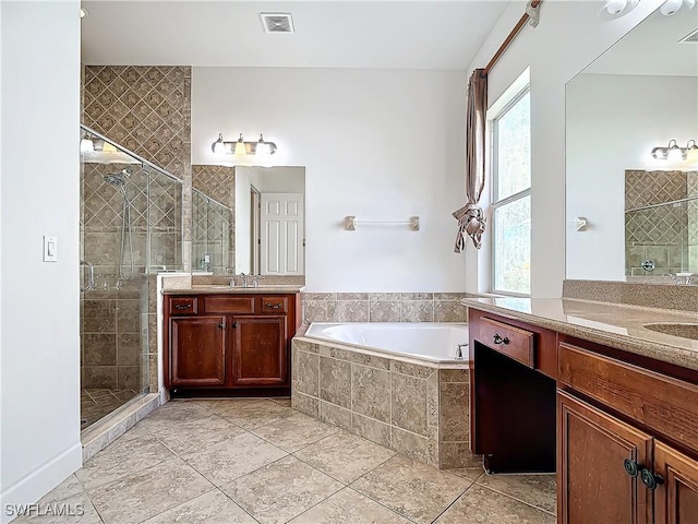 bathroom with tile patterned flooring, a healthy amount of sunlight, and independent shower and bath