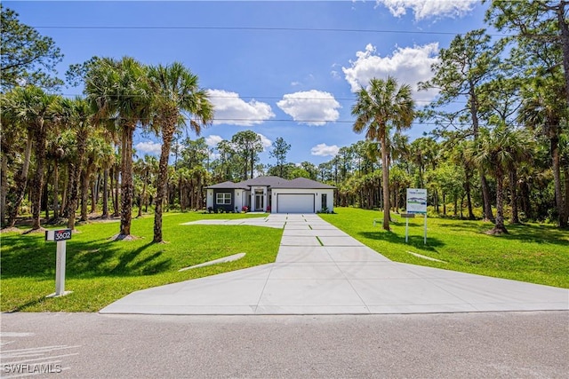 ranch-style house featuring a front yard and a garage