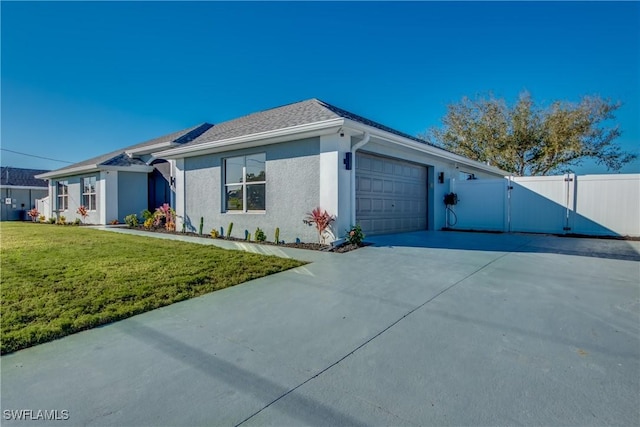 view of front of property featuring a garage and a front lawn