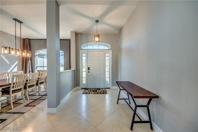 foyer entrance with light tile patterned flooring