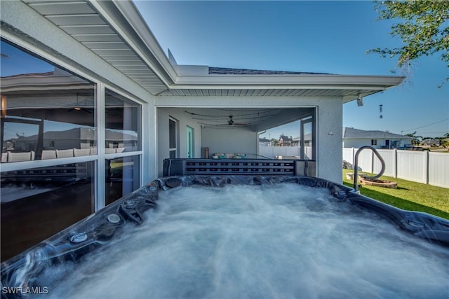 view of patio / terrace with a hot tub