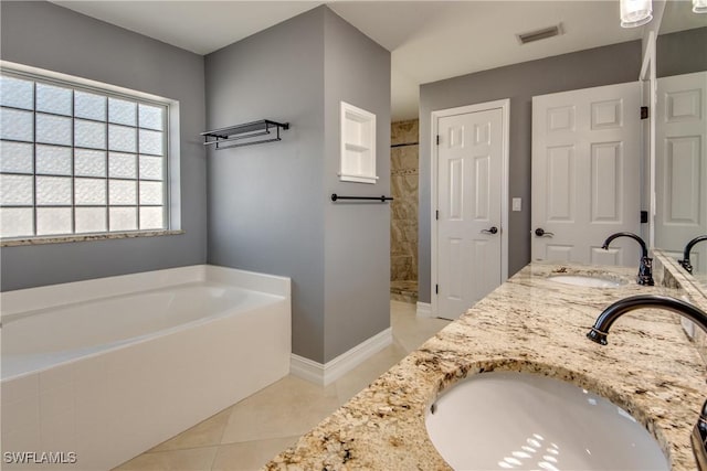 bathroom featuring tile patterned flooring, vanity, and plus walk in shower