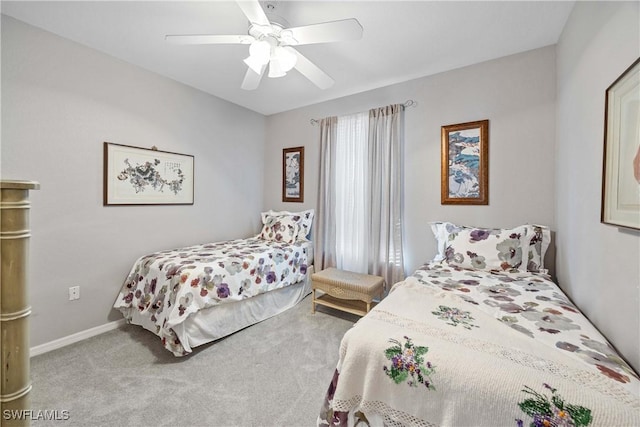 bedroom featuring light colored carpet and ceiling fan