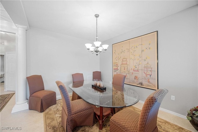 dining area with decorative columns, light tile patterned floors, and a chandelier