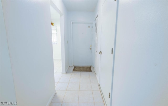 hallway featuring light tile patterned flooring