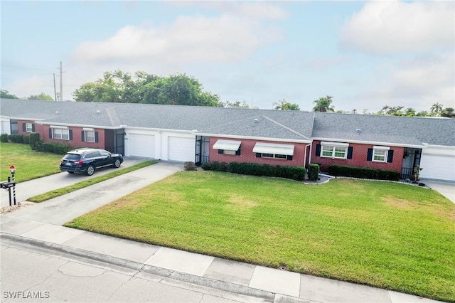 single story home featuring a front yard and a garage