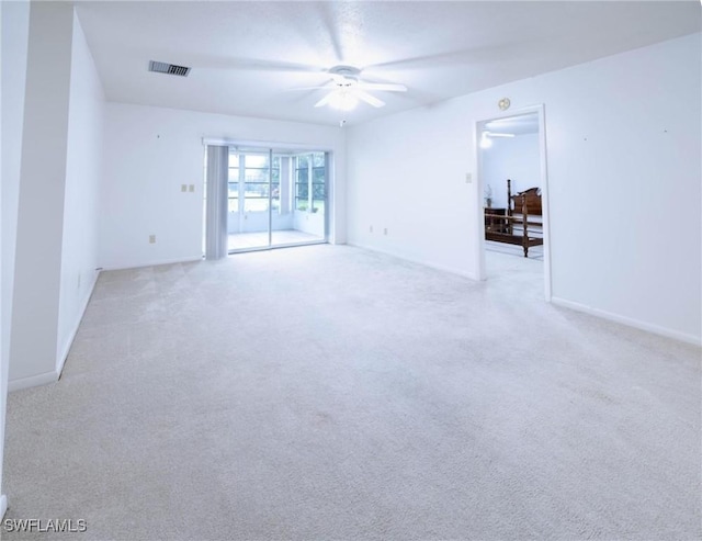 unfurnished room with light carpet and ceiling fan