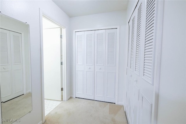 hallway with light carpet