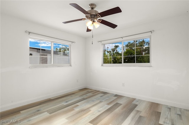 spare room featuring ceiling fan and light wood-type flooring