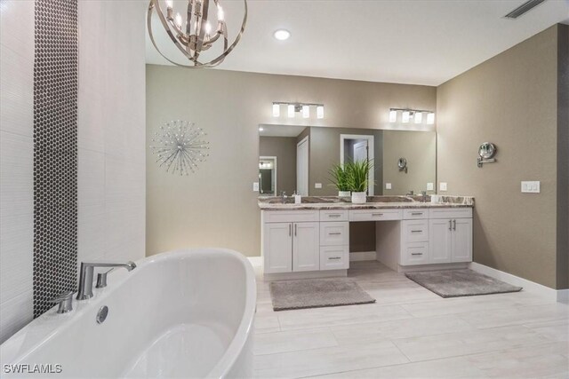 full bathroom with visible vents, a freestanding bath, vanity, and baseboards