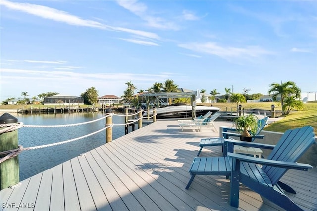 dock area with a water view and boat lift