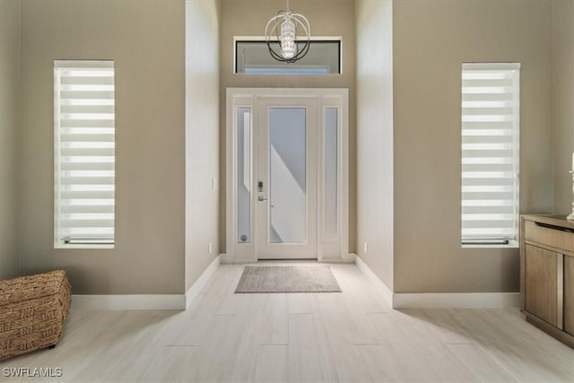 entryway featuring plenty of natural light and light wood-style floors