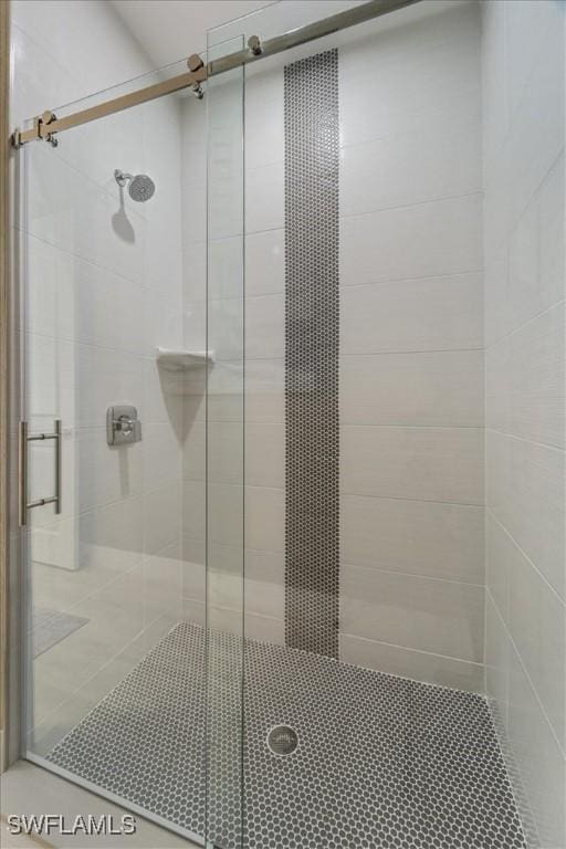 bathroom with a shower stall