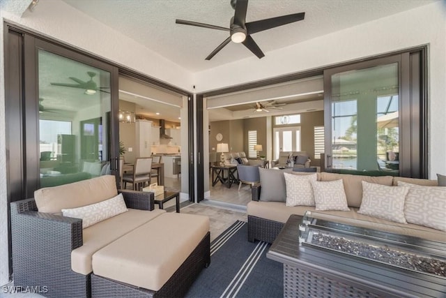 view of patio / terrace with an outdoor living space with a fire pit