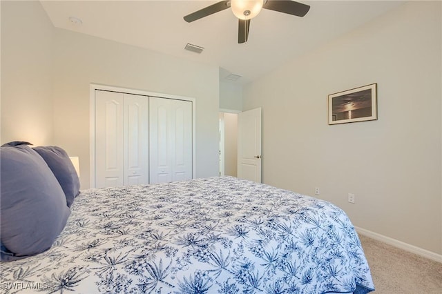 carpeted bedroom featuring ceiling fan and a closet