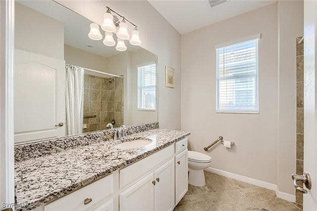 bathroom featuring tile patterned floors, curtained shower, vanity, and toilet