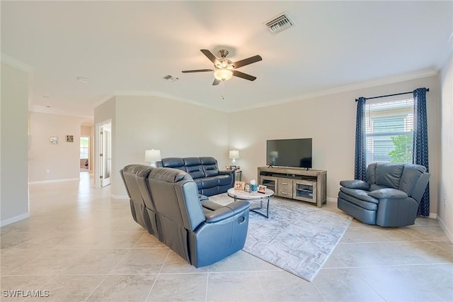 tiled living room featuring ceiling fan and crown molding