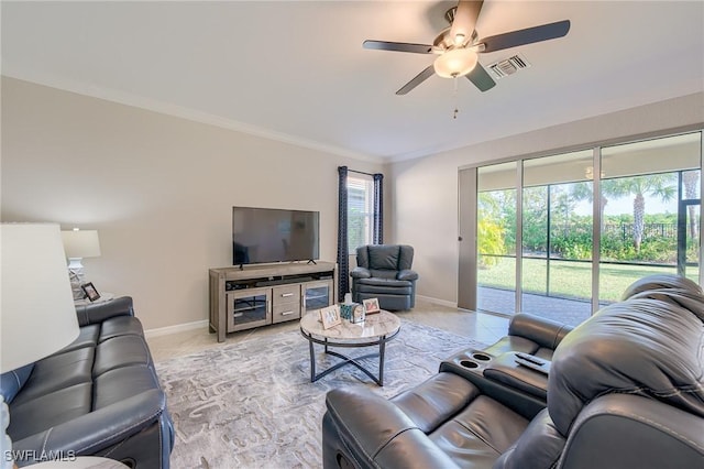 living room with ceiling fan and ornamental molding