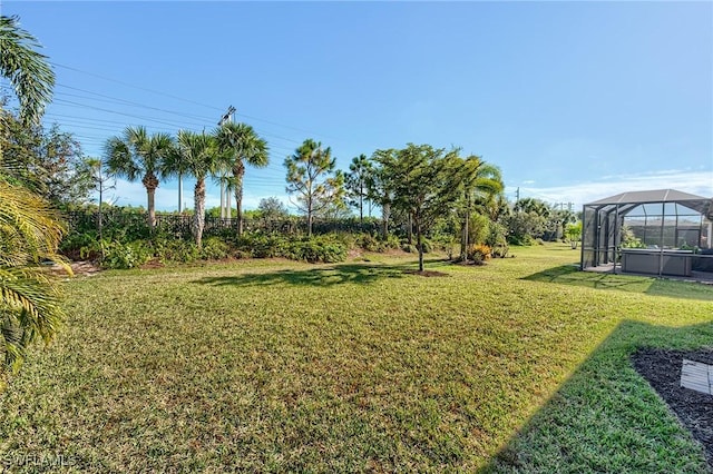 view of yard featuring glass enclosure