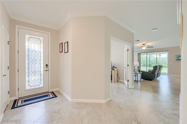 entryway featuring ceiling fan, crown molding, and light tile patterned floors