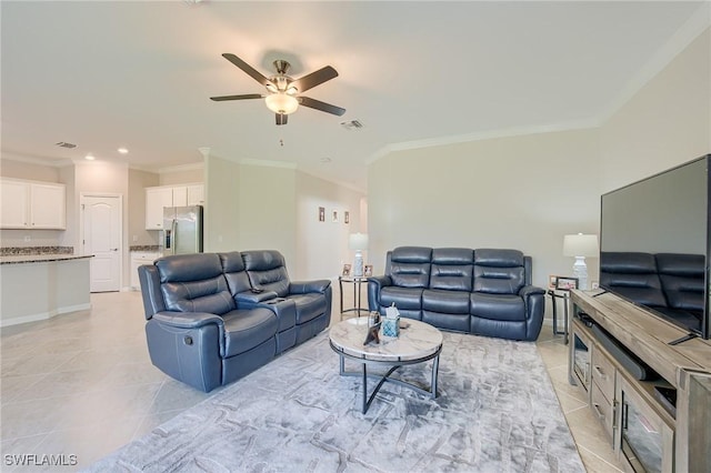 living room with light tile patterned floors, ceiling fan, and ornamental molding