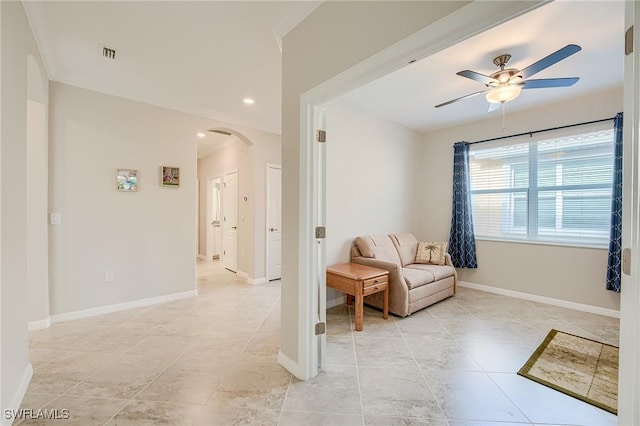 living area featuring ceiling fan and light tile patterned floors