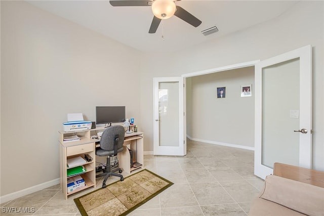 tiled office space featuring ceiling fan and french doors