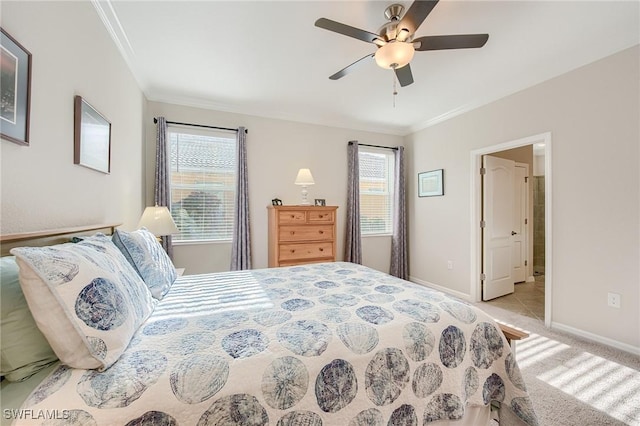 carpeted bedroom featuring ceiling fan and crown molding