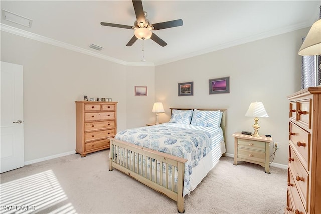 bedroom with light carpet, ceiling fan, and crown molding