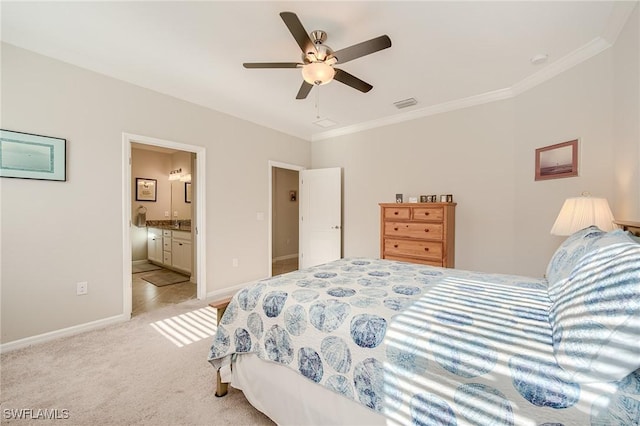 carpeted bedroom with ceiling fan, crown molding, and ensuite bath