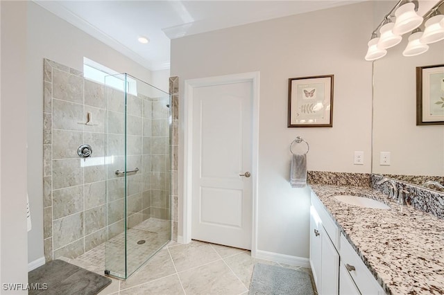 bathroom with a tile shower, crown molding, tile patterned flooring, and vanity