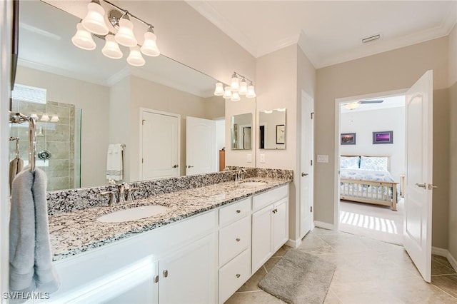 bathroom with a chandelier, vanity, and crown molding